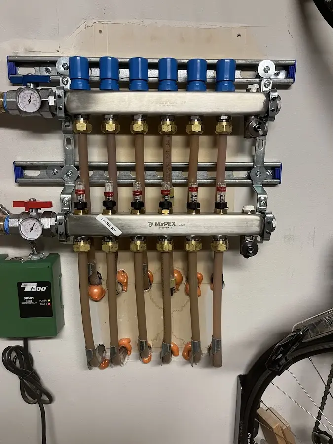 Plumber performing Water Heater Repair at a residential property in Saukville